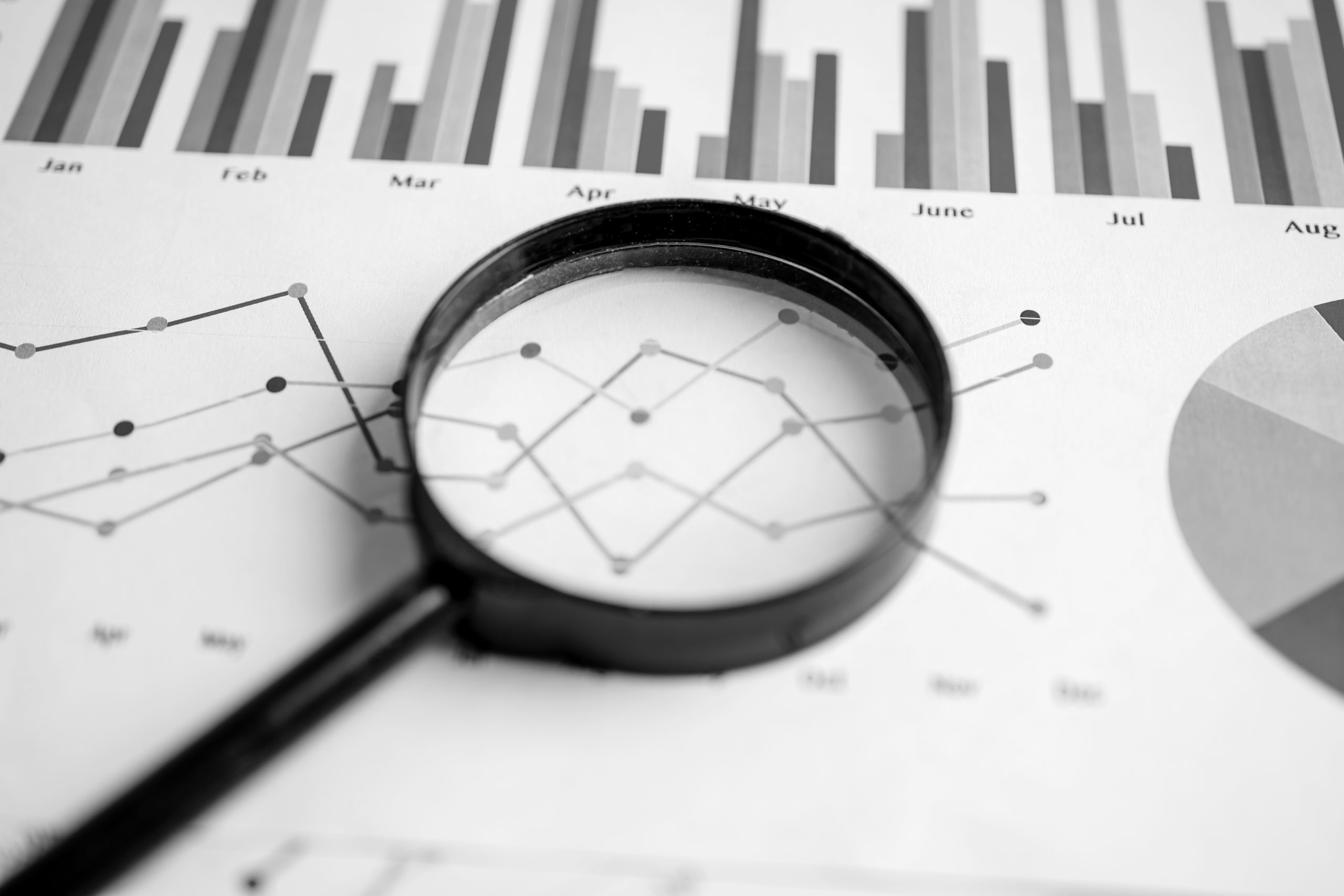 magnifying glass on charts graphs paper financial 2026 01 09 06 37 31 utc scaled